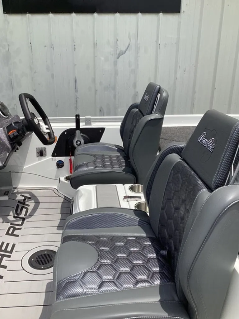 Slide: The Image of Interior of 2026 Bass Cat Cougar FTD with cushioned seats. - 13