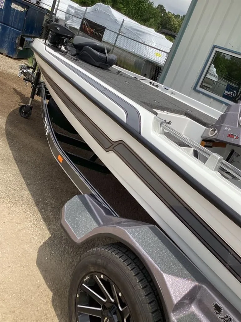 Slide: The Image of 2026 Bass Cat Cougar FTD boat on trailer, side view. - 16