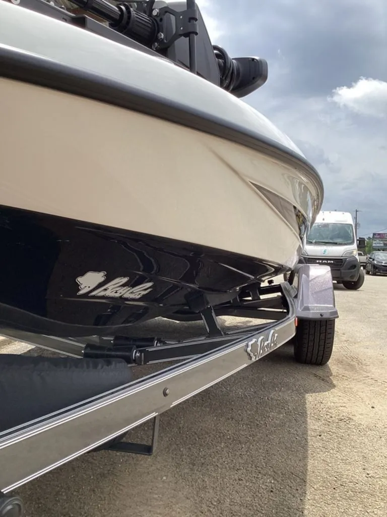 Slide: The Image of 2026 Bass Cat Cougar FTD boat on trailer, side view. - 17