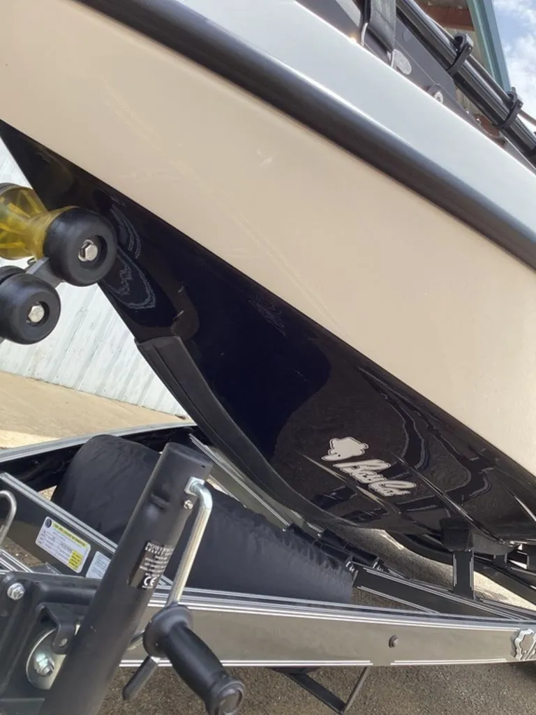 Slide: The Image of 2026 Bass Cat Cougar FTD boat on trailer, close-up view. - 18