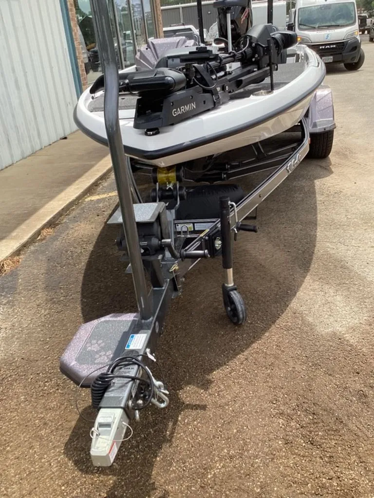 Slide: The Image of 2026 Bass Cat Cougar FTD boat on trailer, Garmin equipment visible. - 19