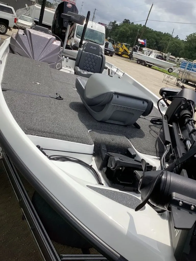 Slide: The Image of 2026 Bass Cat Cougar FTD boat with gray interior on parking lot. - 23