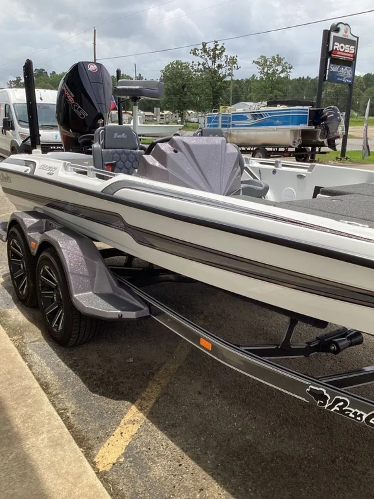 Slide: The Image of 2026 Bass Cat Cougar FTD boat parked on trailer. - 25