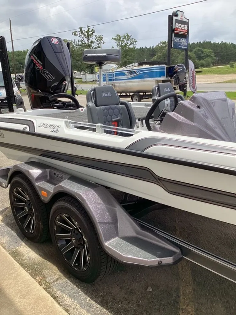 Slide: The Image of 2026 Bass Cat Cougar FTD boat on trailer, side view. - 26