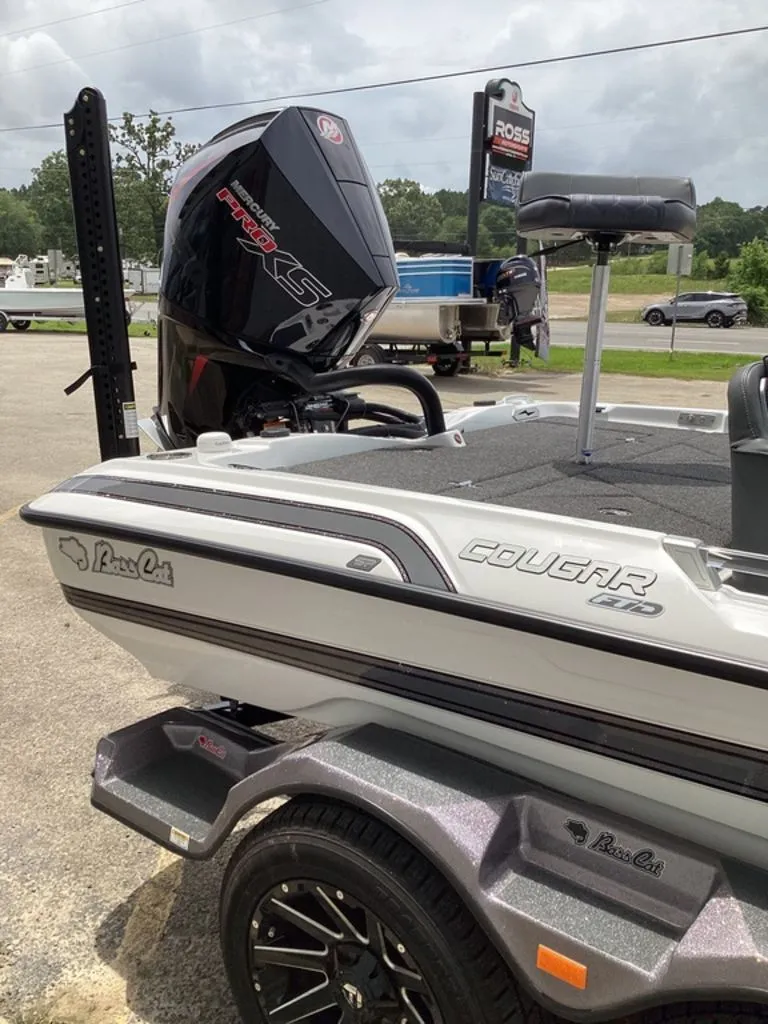 Slide: The Image of 2026 Bass Cat Cougar FTD boat with powerful outboard motor. - 27