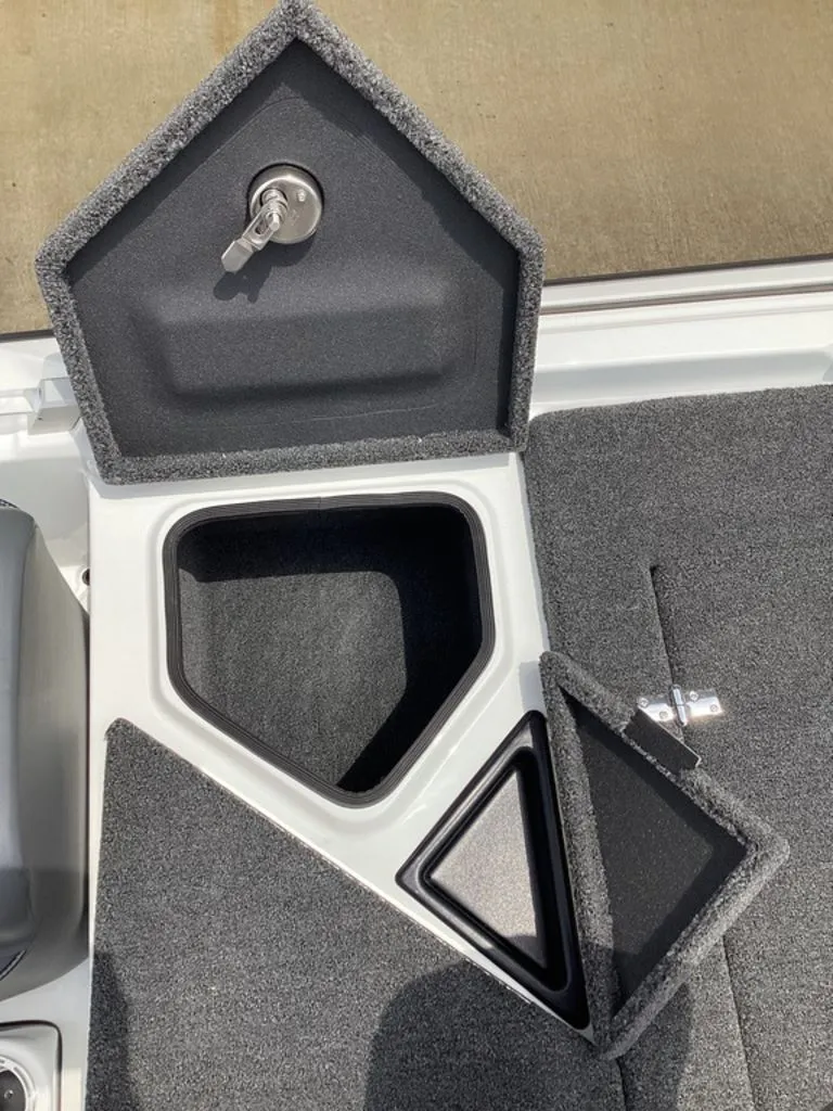 Slide: The Image of Bass Cat Cougar FTD 2026 storage compartments with carpeted interior and key lock. - 31