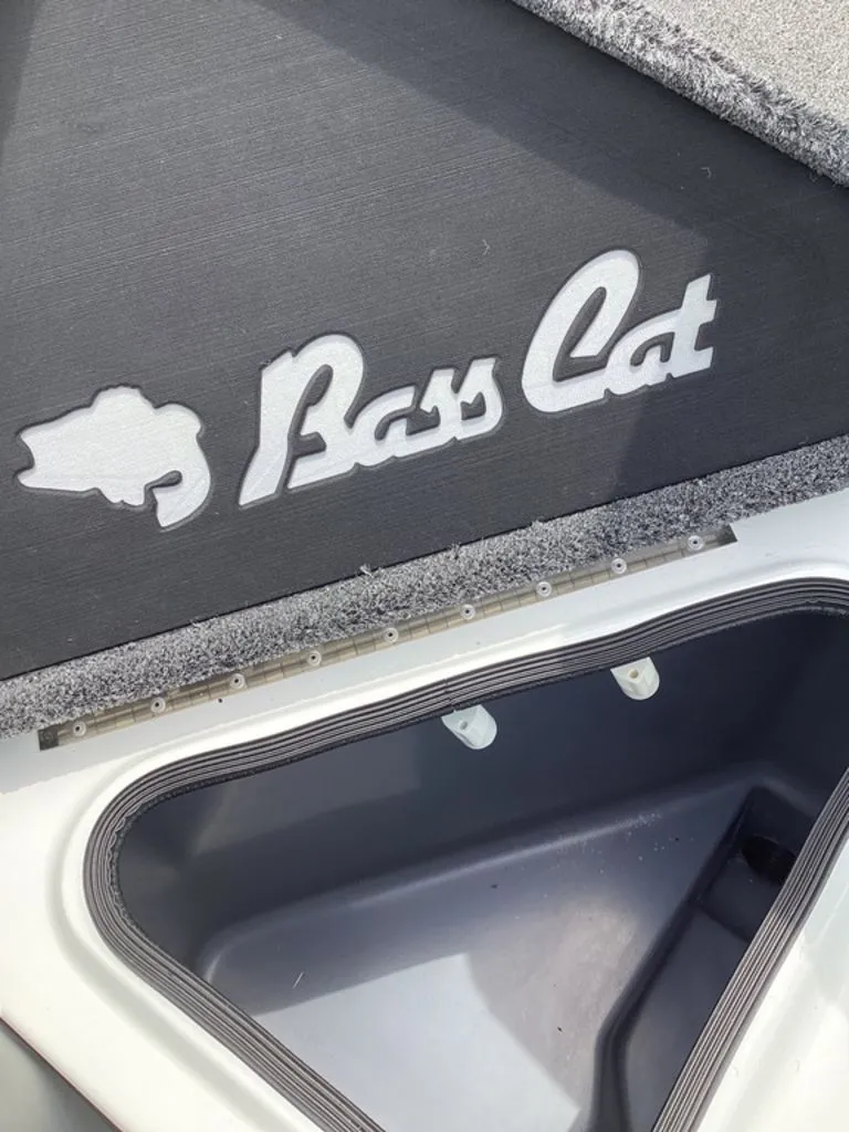 Slide: The Image of Bass Cat Cougar FTD 2026 boat with storage compartment and logo. - 36