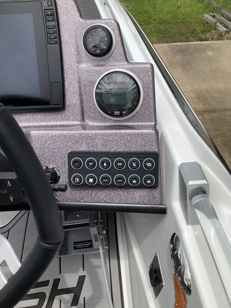 Slide: The Image of Dashboard of 2026 Bass Cat Cougar FTD with controls and gauges. - 47
