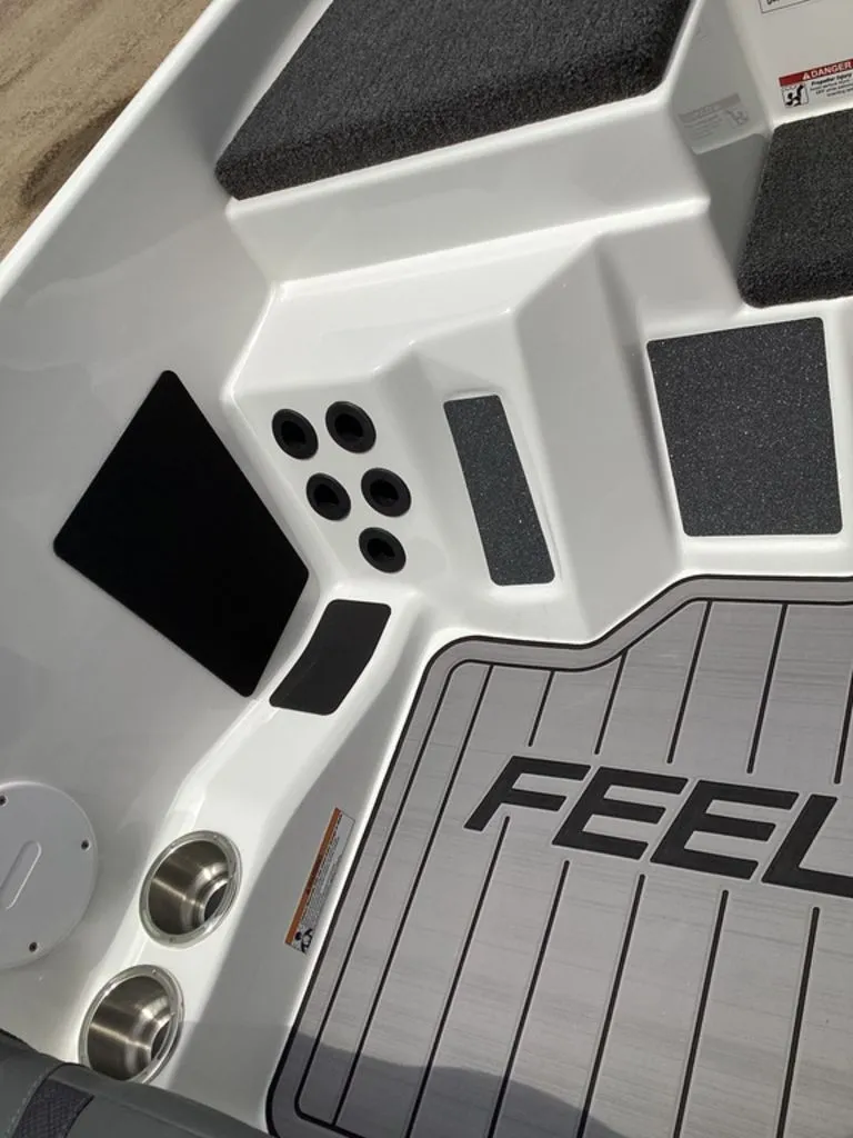 Slide: The Image of Interior of 2026 Bass Cat Cougar FTD with cup holders and non-slip flooring. - 48