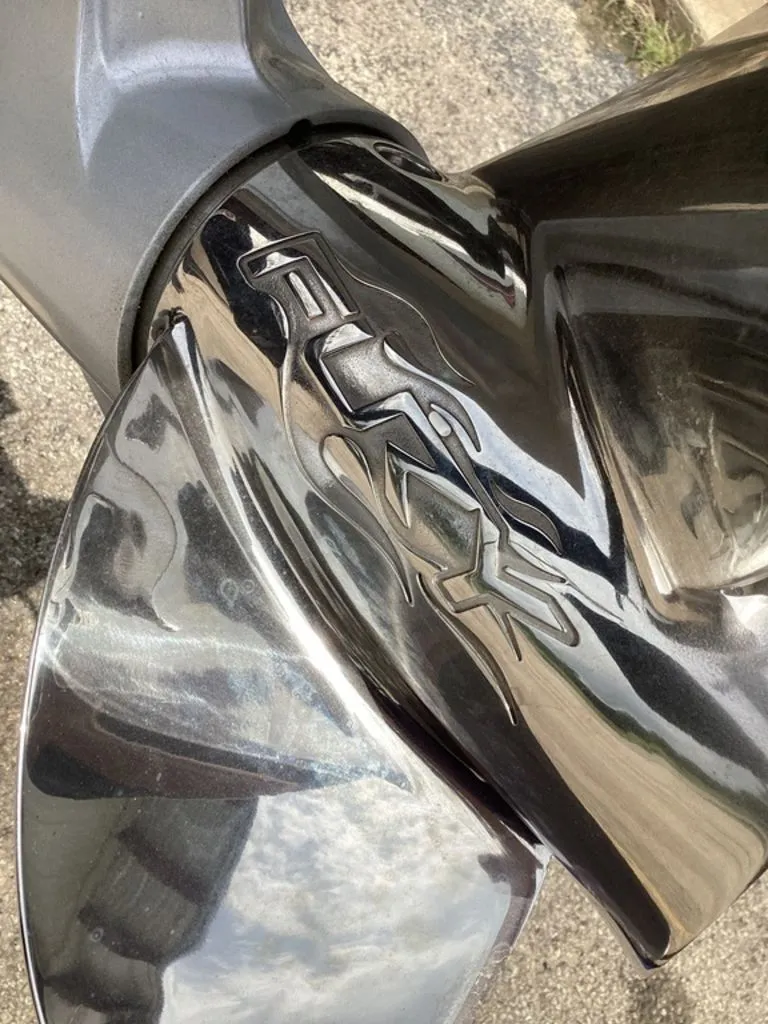 Slide: The Image of Close-up of a shiny boat propeller with Fury logo, Bass Cat Cougar FTD 2026. - 5