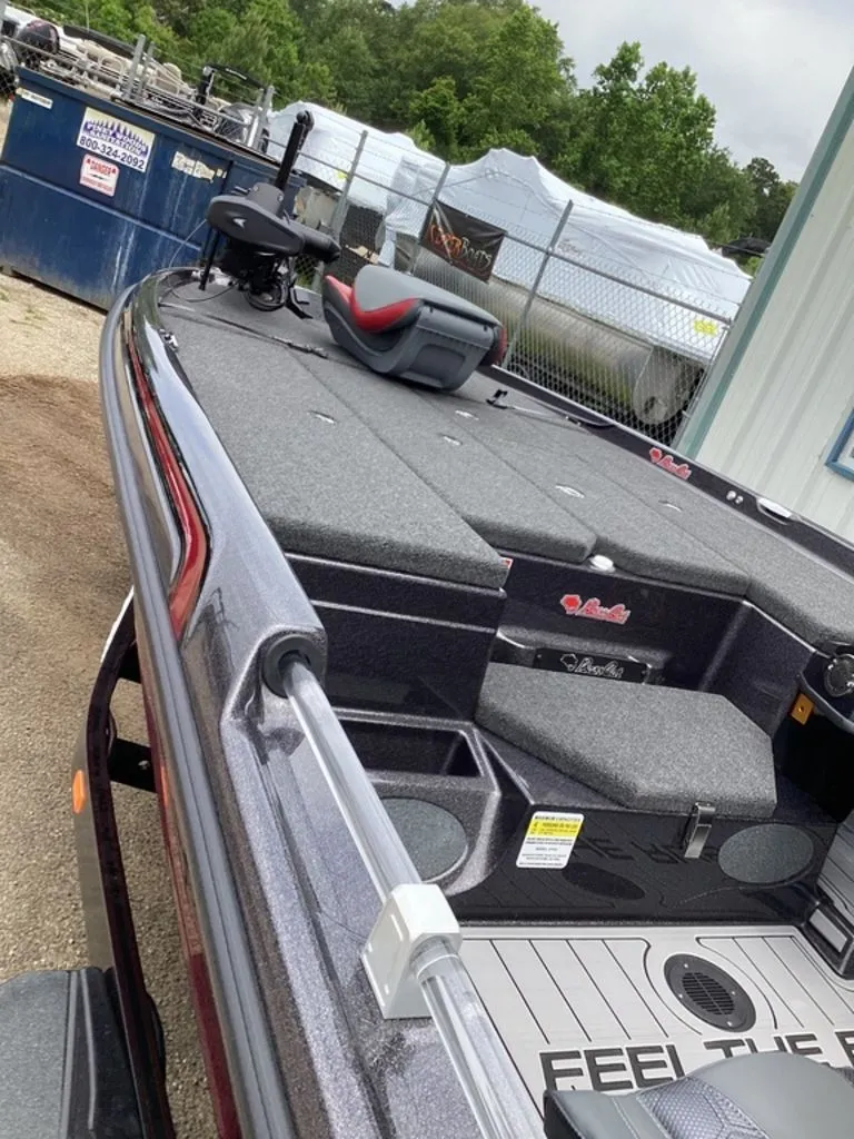 Slide: The Image of 2026 Bass Cat Eyra boat with gray deck and red seat. - 14