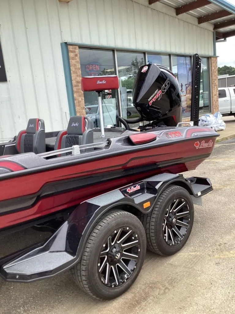 Slide: The Image of 2026 Bass Cat Eyra boat with trailer, side view. - 15