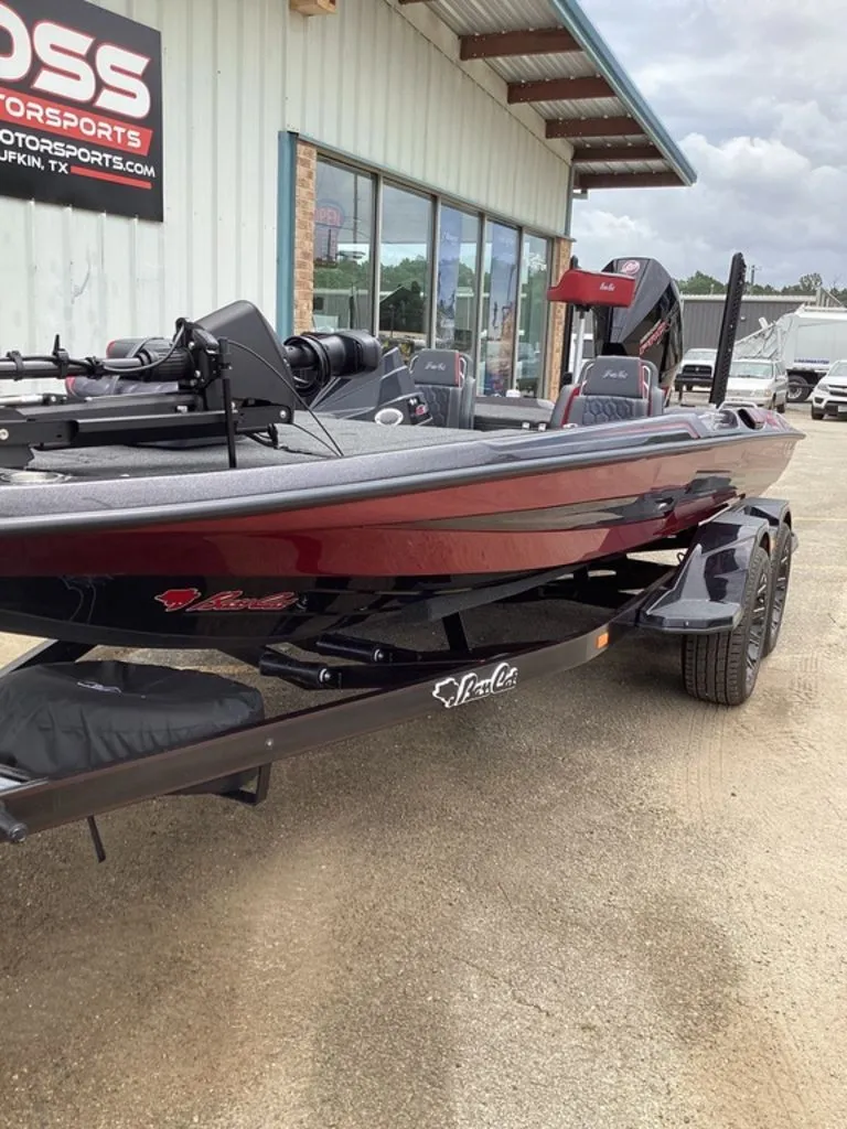 Slide: The Image of 2026 Bass Cat Eyra boat parked outside a store. - 17