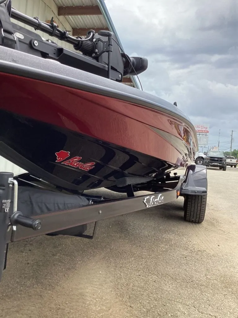Slide: The Image of 2026 Bass Cat Eyra boat on trailer, side view. - 18