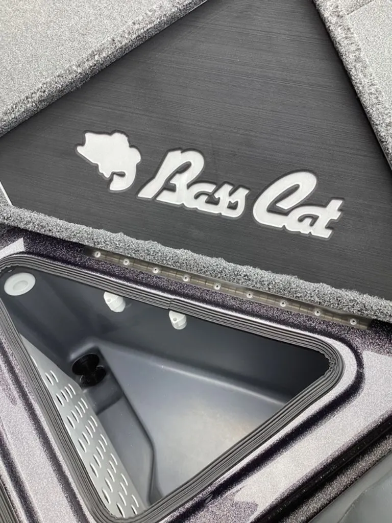 Slide: The Image of 2026 Bass Cat Eyra boat with open storage compartment. - 37