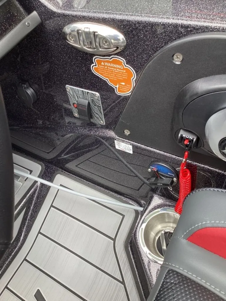 Slide: The Image of Interior of 2026 Bass Cat Eyra with controls and warning label. - 43