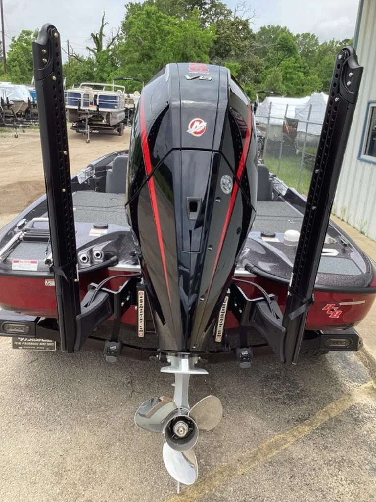 Slide: The Image of Rear view of a 2026 Bass Cat Eyra boat with outboard motor. - 5