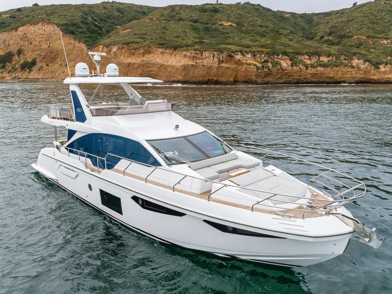 Slide: The Image of Azimut Fly 60 Yacht 2020 near coastal landscape. - 12