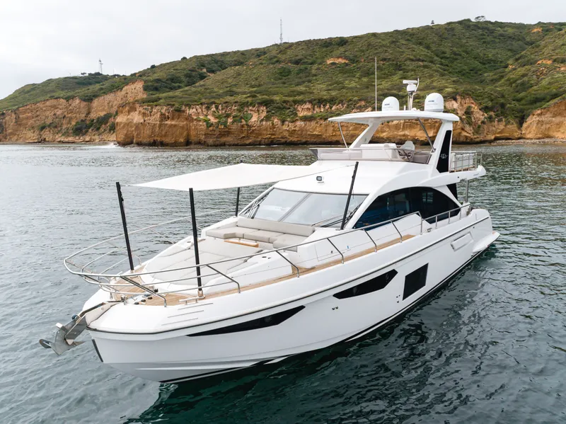 Slide: The Image of Azimut Fly 60 Yacht 2020 near rocky coastline. - 13