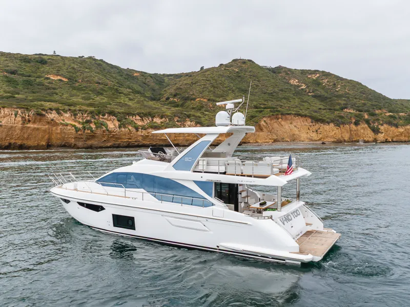 Slide: The Image of Azimut Fly 60 Yacht 2020 near coastal landscape. - 17