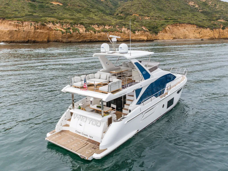 Slide: The Image of Azimut Fly 60 Yacht 2020 on calm waters near coastal landscape. - 20