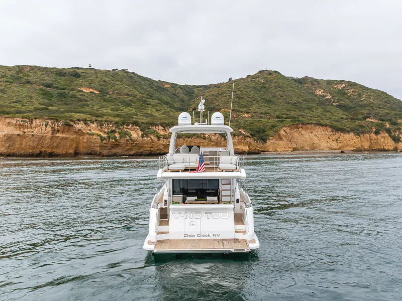 Slide: The Image of 2020 Azimut Fly 60 yacht cruising near rocky coastline. - 21