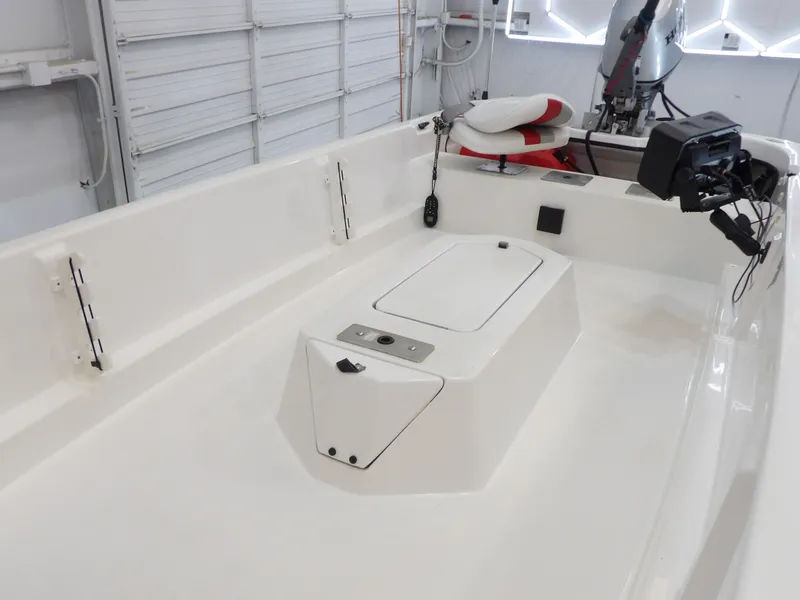 Slide: The Image of Interior view of a 2017 Bass Cat Phelix boat in a garage. - 15