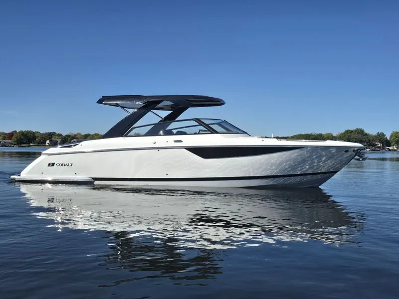 The Image of 2025 Cobalt R35 boat on calm water under clear sky. - 1
