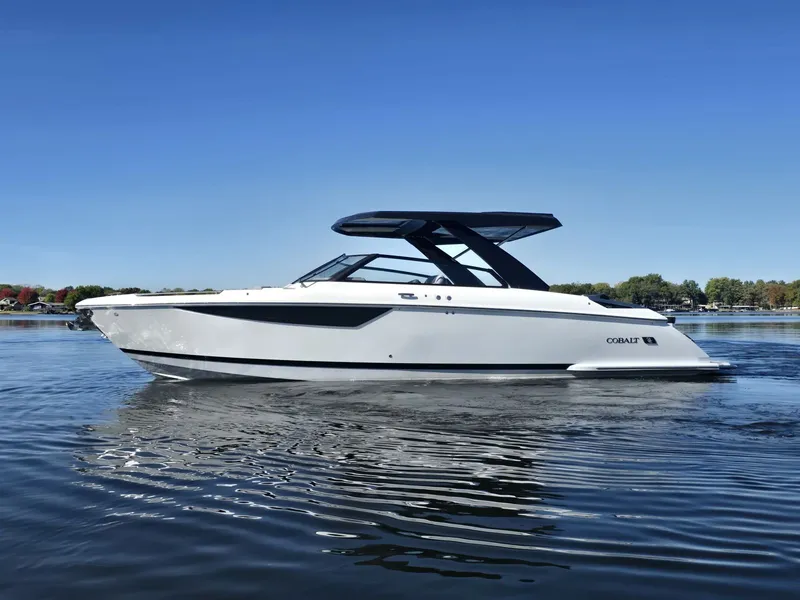 Slide: The Image of 2025 Cobalt R35 boat on calm water under clear sky. - 5