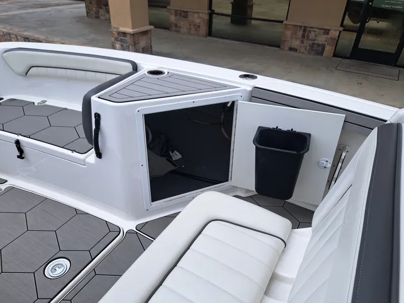 Slide: The Image of Interior of a 2020 Yamaha 210 FSH Sport boat with storage area. - 12