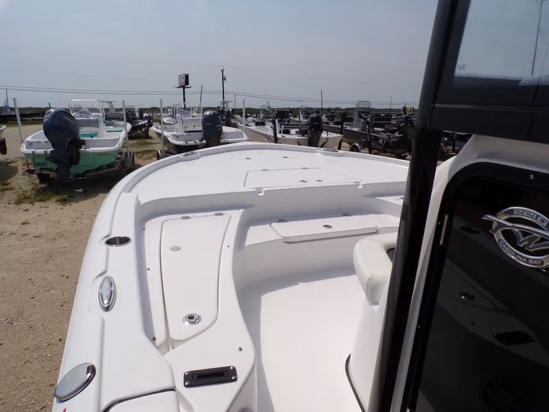 Slide: The Image of 2026 Tidewater 2210 Carolina Bay boat in a parking lot. - 24