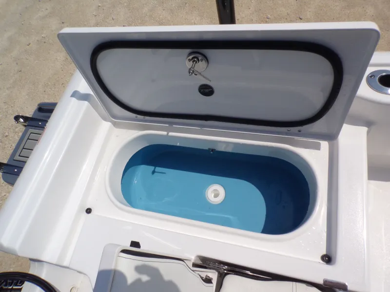 Slide: The Image of Open storage compartment on Tidewater 2210 Carolina Bay 2026 boat. - 38