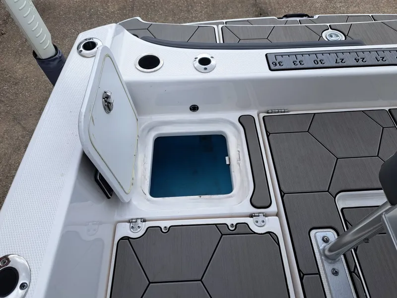 Slide: The Image of Yamaha 210 FSH Sport 2020 with open storage compartment and measuring scale. - 21