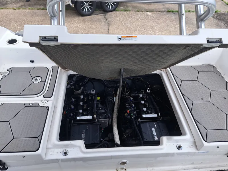 Slide: The Image of Engine compartment of a 2020 Yamaha 210 FSH Sport boat. - 22