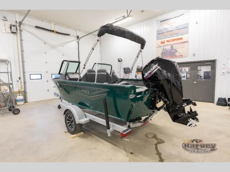 Slide: The Image of 2026 Explorer Sport 1800 boat in a workshop with Mercury engine. - 5