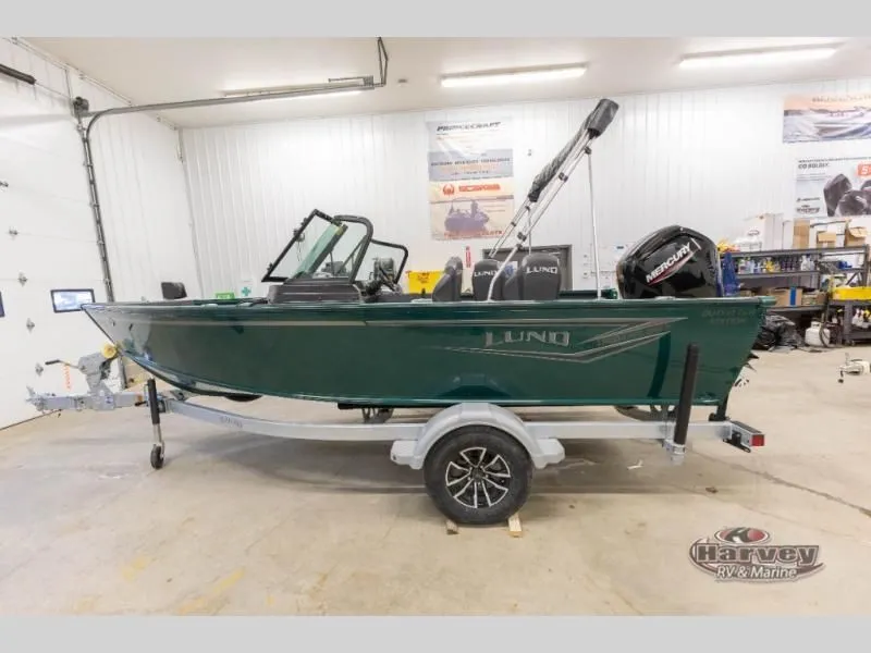 Slide: The Image of Green Explorer Sport 1800 boat on trailer in workshop. - 6