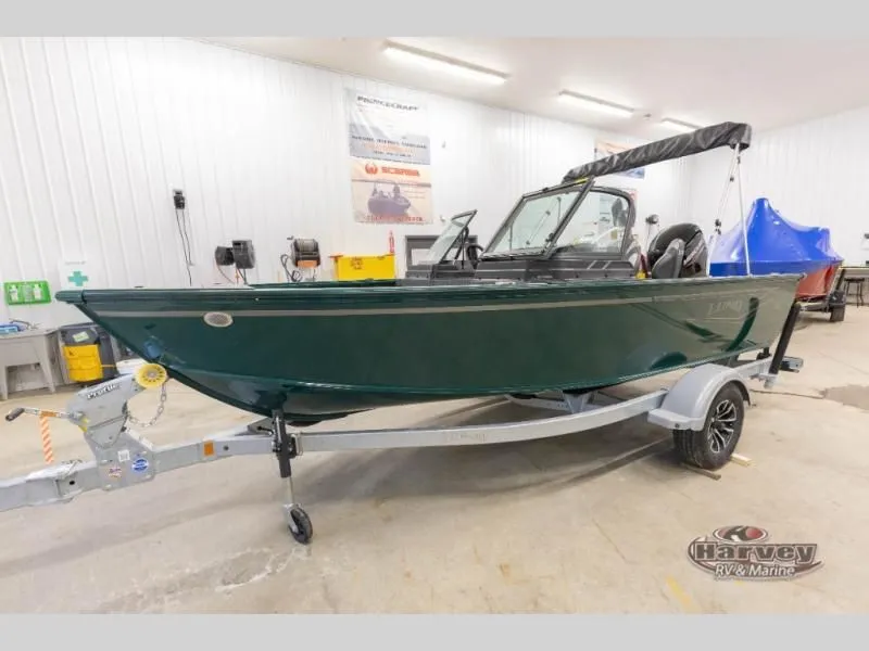 Slide: The Image of 2026 Explorer Sport 1800 boat on trailer in workshop. - 7