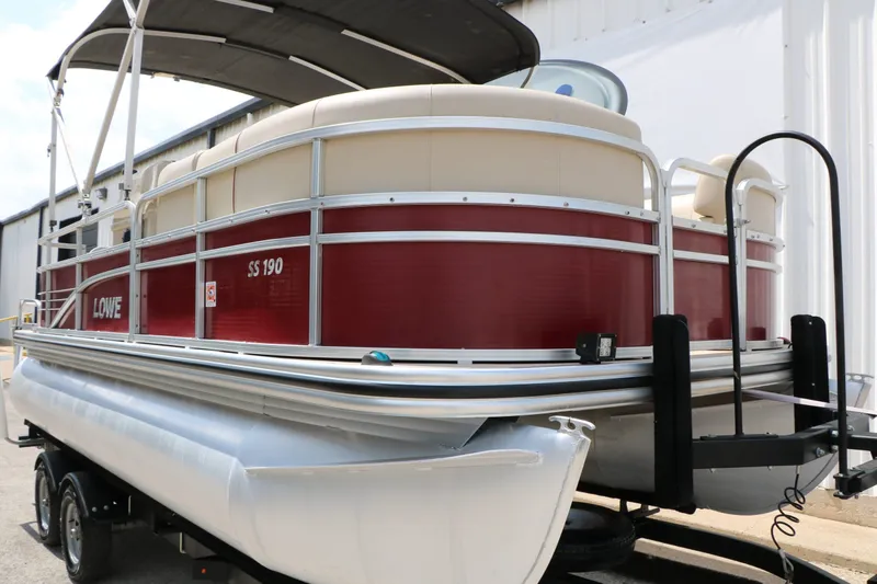 Slide: The Image of 2016 Lowe SS190 pontoon boat on trailer, red siding. - 12