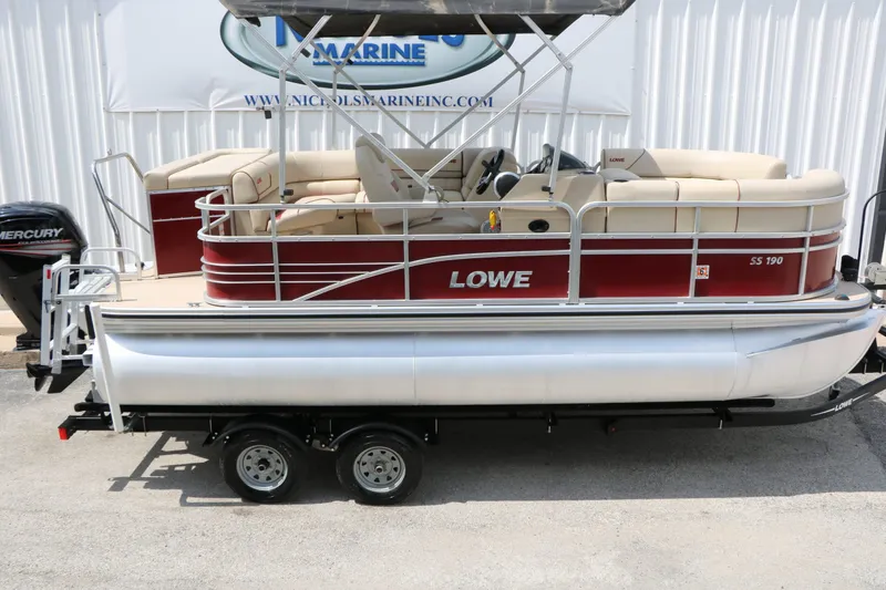 Slide: The Image of 2016 Lowe SS190 pontoon boat with red design and Mercury engine. - 13