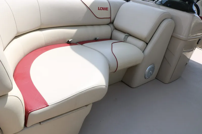 Slide: The Image of Lowe SS190 2016 boat seating with cream and red upholstery. - 18