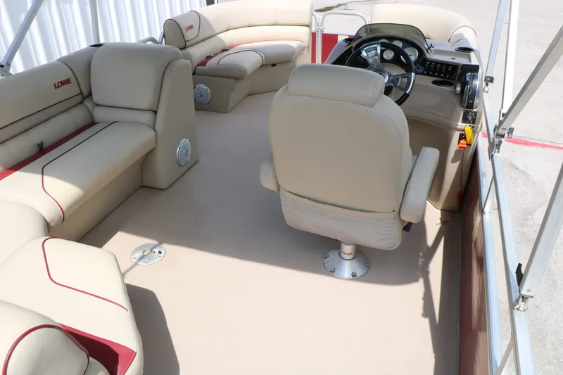 Slide: The Image of Interior of a 2016 Lowe SS190 pontoon boat with beige seating. - 21
