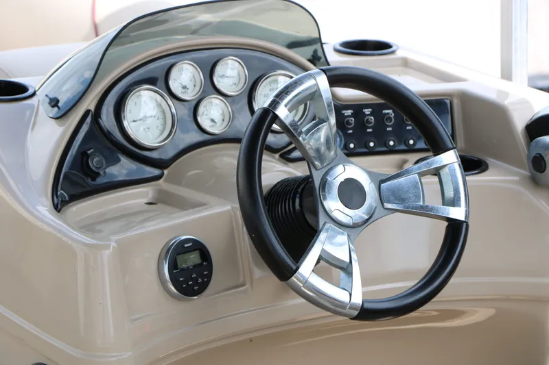Slide: The Image of 2016 Lowe SS190 boat steering console with gauges. - 25