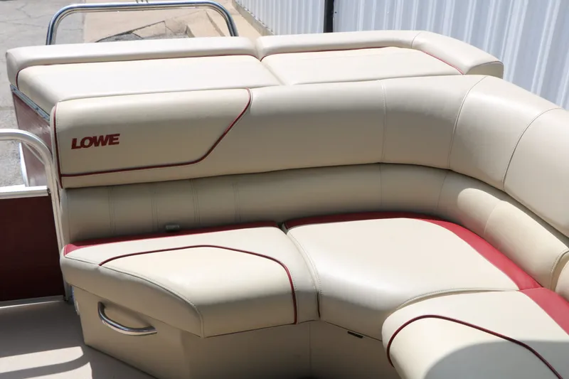 Slide: The Image of Lowe SS190 2016 boat seating with cream leather and red accents. - 34
