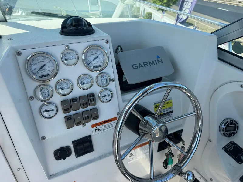 Slide: The Image of 2004 Seaswirl Striper 2601 helm with Garmin navigation system. - 10