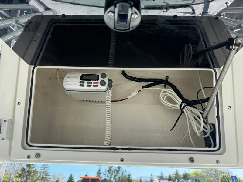 Slide: The Image of Seaswirl Striper 2601 2004 radio and cables in storage compartment. - 12