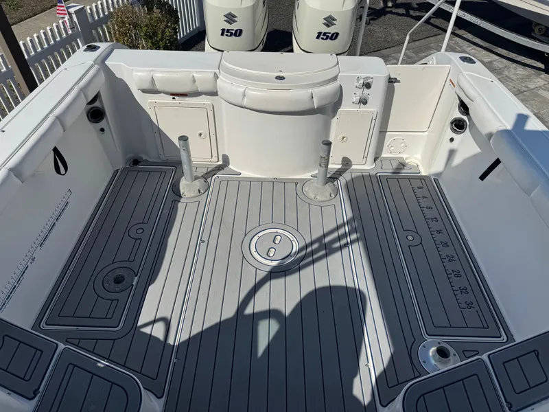 Slide: The Image of Interior of a 2004 Seaswirl Striper 2601 boat with Suzuki engines. - 14
