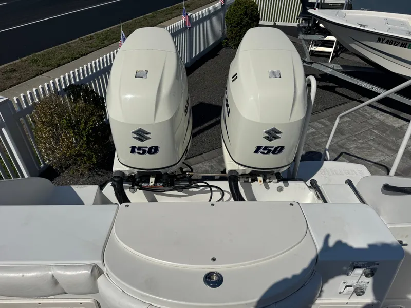 Slide: The Image of 2004 Seaswirl Striper 2601 with Suzuki 150 HP outboard motors. - 18