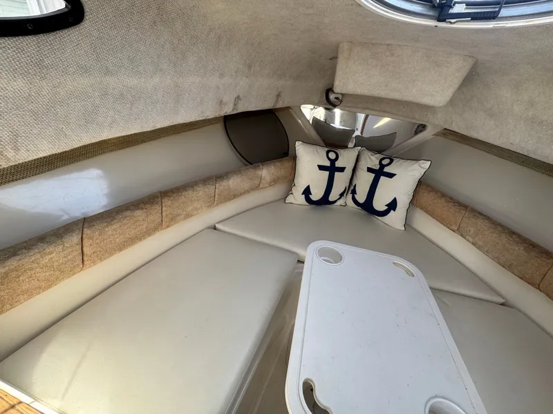 Slide: The Image of Interior of a 2004 Seaswirl Striper 2601 with anchor pillows. - 7