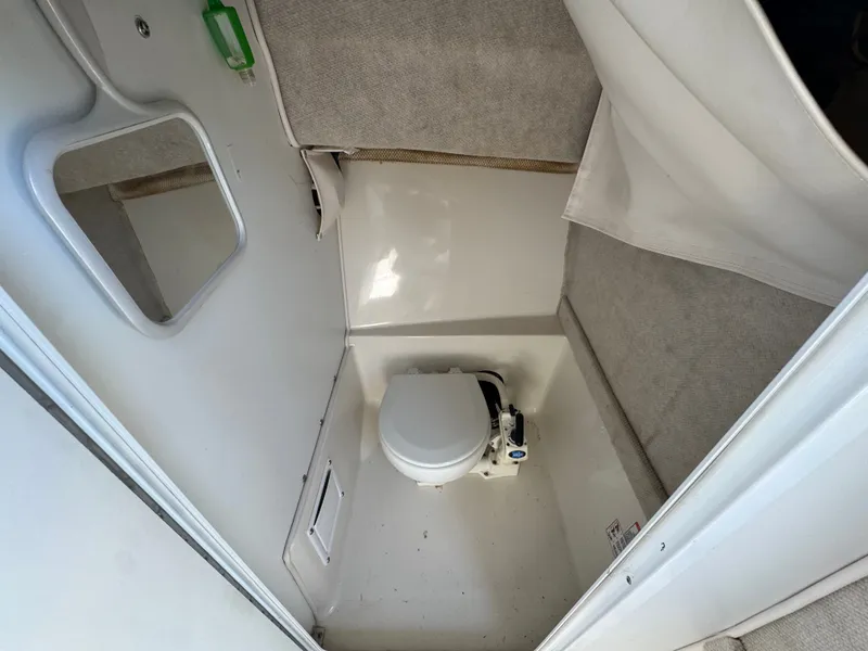 Slide: The Image of Interior of a 2004 Seaswirl Striper 2601 with toilet. - 9