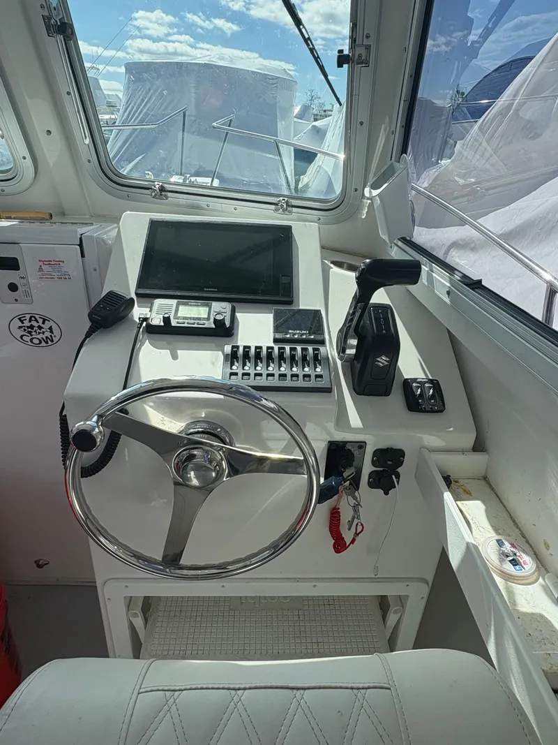 Slide: The Image of Helm of a 2019 Steiger Craft 23 Chesapeke boat. - 2